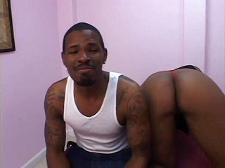 Tattooed black stud fucks big ass black slut's shaved pussy